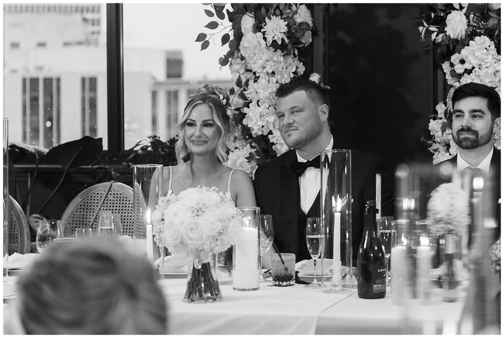 black and white bride and groom at book tower