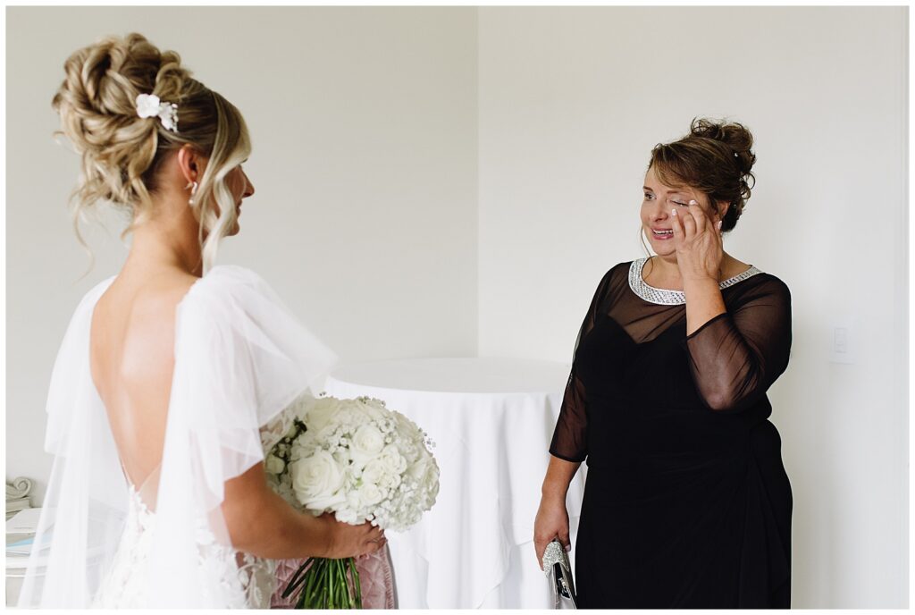 brides first look with her mother at the book tower
